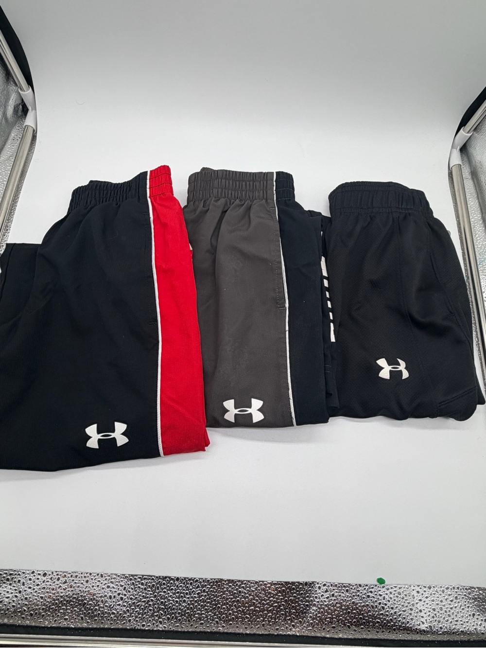 THREE Under Armour Kids Black PANT/ joggers in black, grey and red sz. Youth XS